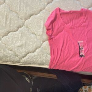 It is a no boundaries pink tee shirt new